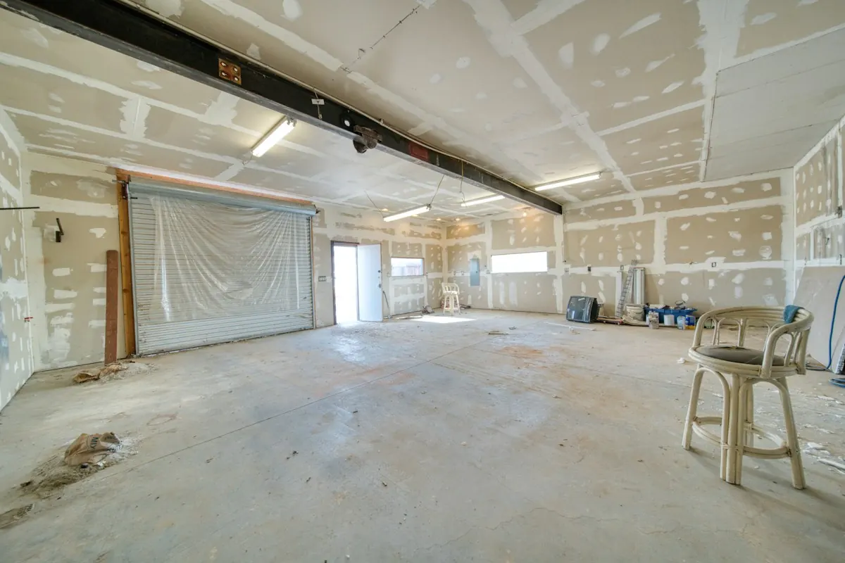 Large room with walls freshly patched and painted
